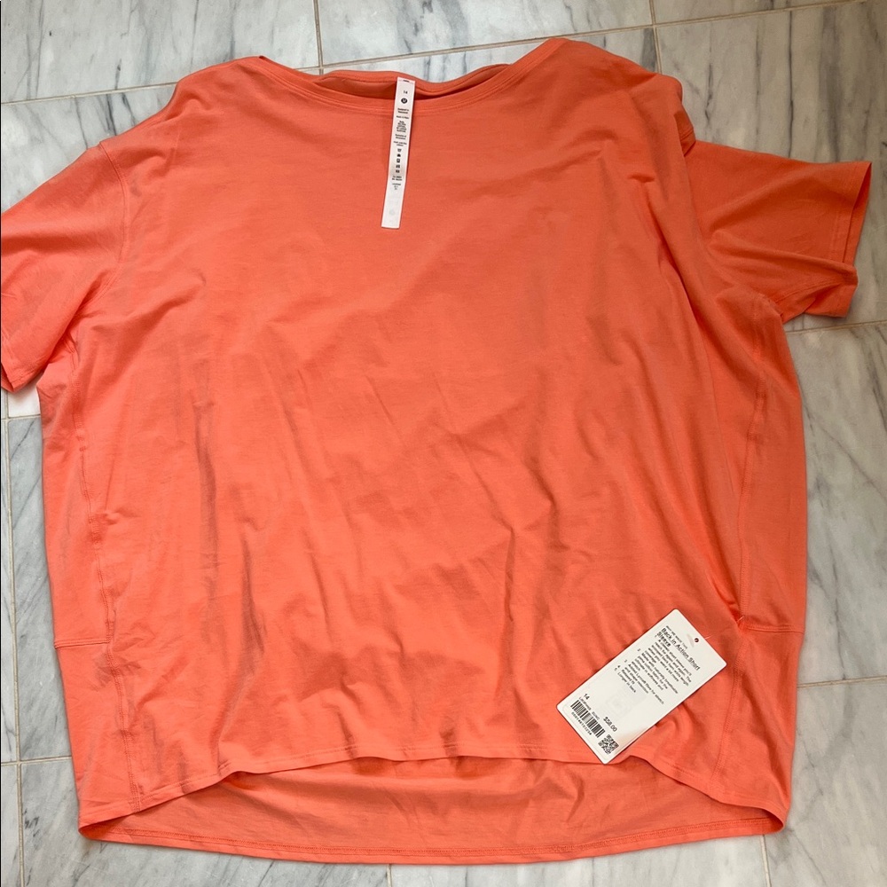 Lululemon back in action short sleeve size 14 coral
